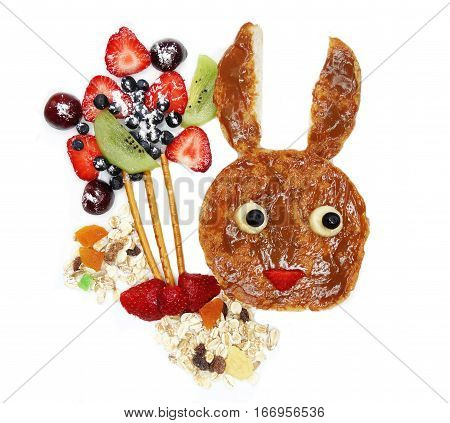 creative breakfast food with fruit and chocolate sweet cream on bread