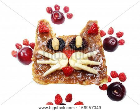 creative breakfast food with fruit and chocolate sweet cream on bread