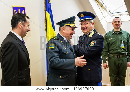 Záhony Hungary - January 25 2017: Head of the State Borderguard Service of Ukraine colonel general Viktor Nazarenko (C) and the deputy police chief - chief of law enforcement of Hungary major general Zsolt Halmosi (R2) communicate during the opening of th