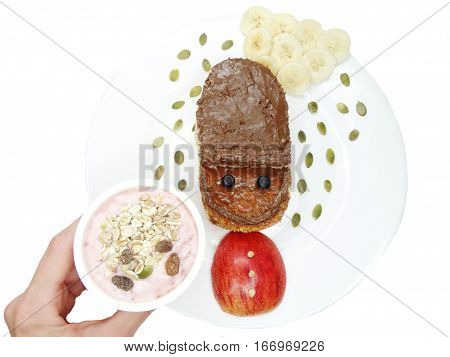 creative breakfast food with fruit and chocolate sweet cream on bread