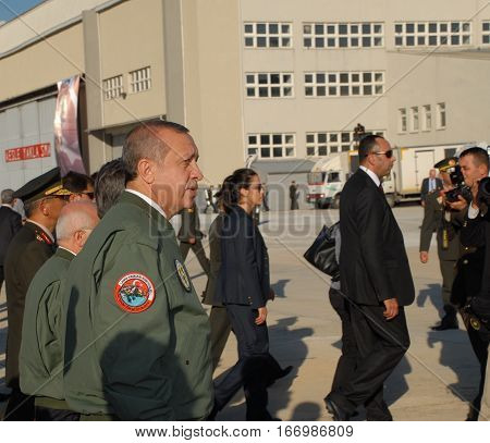 ANKARA, TURKEY - JUNE 10 2014 : Turkish Prime Minister Recep Tayyip Erdogan (in flight jacket) on the apron of Turkish Land Forces Aviation Command 