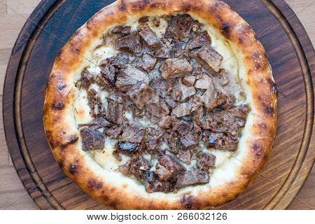 Turkish Round Pide With Meat Kavurma And Cheese.