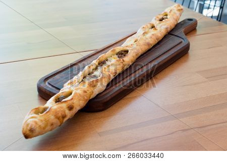 Turkish Bafra Pide With Minced Meat Kavurma Salad And Pickles. Traditional Food.