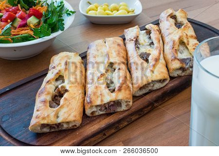Turkish Bafra Pide With Minced Meat Kavurma Salad And Pickles.