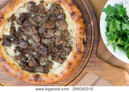 Turkish Round Pide With Meat Kavurma And Cheese. Traditional Food.