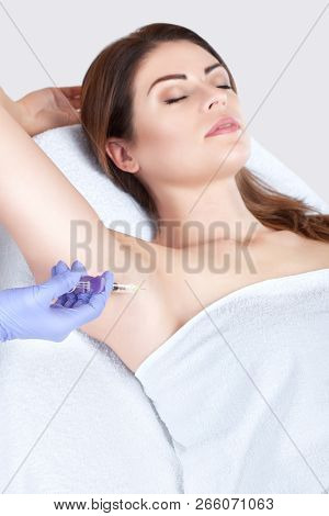 The Doctor Makes Intramuscular Injections Of Botulinum Toxin In The Underarm Area Against Hyperhidro