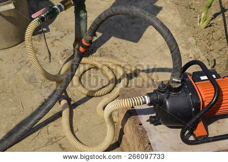 Self-priming Garden Pump And Hose System Connected To It
