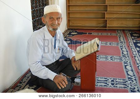 Tirana, Albania - September 7, 2009:  Local Albalnian Reading A Religious Book Inside The Ethem Bej 