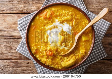 Delicious Tamil Mulligatawny Soup With Lentils, Rice, Chicken, Vegetables And Apple Closeup In A Bow