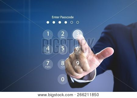 Businessman Entering Security Passcode On A Virtual Login Keypad Screen To Login To An Encrypted Com