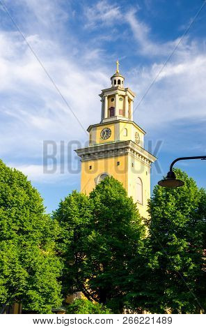 Bell Tower And Clock Of Protestant Santa Maria Magdalena Church Kyrka On Sodermalm Island With Green