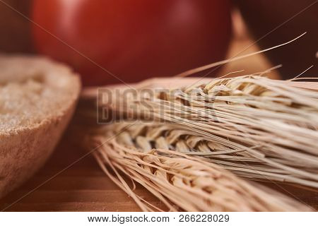 Wheat Sprouts Close Up With Bread And Tomato. Concept Of Homefood