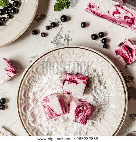 Blackcurrant Swirl Marshmallow In A Plate With Icing Sugar, Square