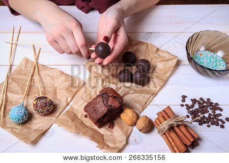 Woman Making Chocolate Popcakes Top View. Cake Pops Making. Pop Cakes.