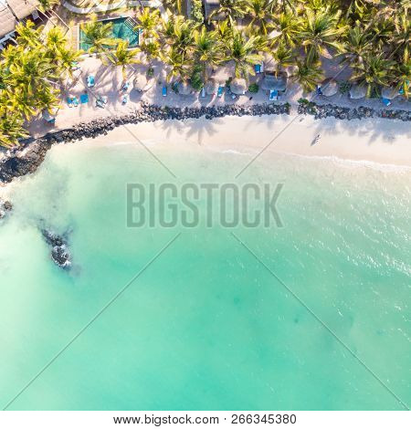 Aerial View Of Amazing Tropical White Sandy Beach With Palm Leaves Umbrellas And Turquoise Sea, Maur