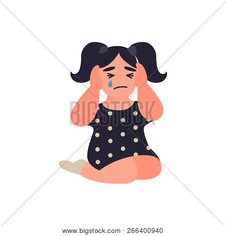 Little Girl Covers Her Ears Not To Hear Parents Quarrel. Child Is Sitting On The Floor And Crying. U