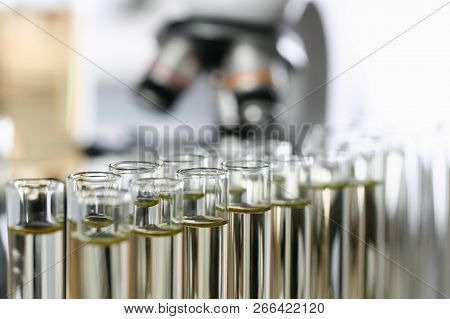 Yellow Liquid Spilled Petrol Additive Innovative Supply In Glass Tube. Conveyor Line Production Hous