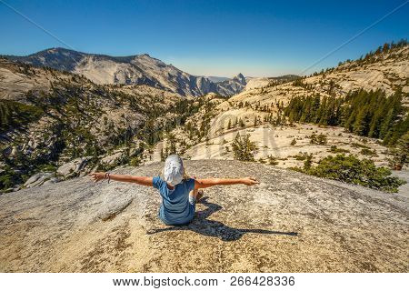 Hiking Enthusiastic Woman Relaxing At Olmsted Point And Looking The North Side Half Dome. Tired Hike