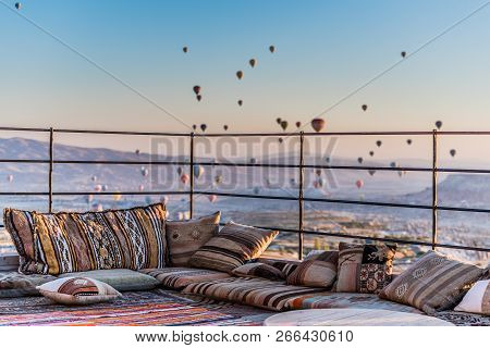 Rooftop Terrace Decorated With Pillows And Carpets In Turkish Style With The View In The Morning Ove