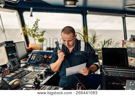 Marine Navigational Officer Is Reporting By Vhf Radio