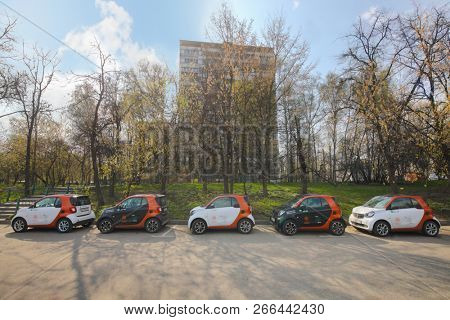 MOSCOW - APR 30, 2018: Five Mercedes Benz Smart cars of Moscow carsharing company You drive on sunny street, carsharing is system of short-term car rental