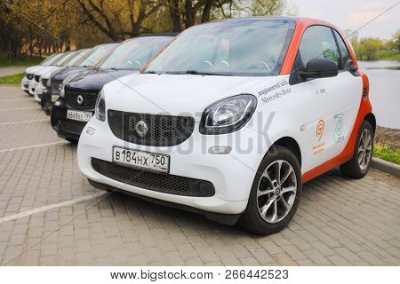 MOSCOW - APR 30, 2018: Six Mercedes Benz Smart cars of Moscow carsharing company You drive in park, carsharing is system of short-term car rental