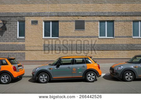MOSCOW - APR 29, 2018: Three BMW mini cars of Moscow carsharing company You drive are on sunny street, carsharing is system of short-term car rental with per minute payment