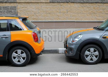 MOSCOW - APR 29, 2018: Two grey BMW mini cars of Moscow carsharing company You drive are on street, carsharing is system of short-term car rental with per minute payment