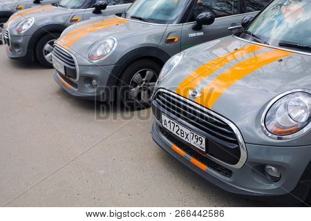 MOSCOW - APR 29, 2018: Three grey BMW mini cars of Moscow carsharing company You drive are on asphalt, carsharing is system of short-term car rental with per minute payment