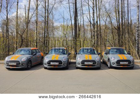 MOSCOW - APR 29, 2018: Four grey BMW mini cars of Moscow carsharing company You drive in park, carsharing is system of short-term car rental with per minute payment