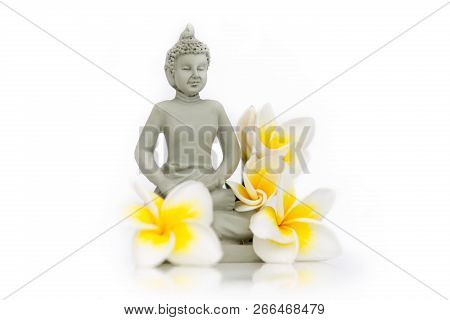 Buddha Statue With Frangipani Flowers On White Background