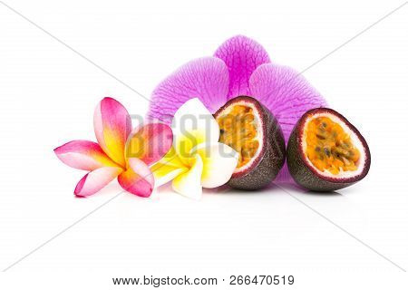 Passion Fruit Cut In Half With Frangipani Floower On White