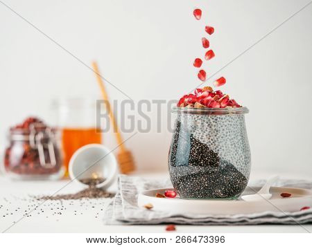 Healthy Breakfast Concept And Idea - Two Colors Chia Pudding With Organic Raw Pomegranate. Glass Jar