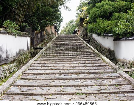 Stone Steps And White Plaster Walls In Historic Samurai District Of Kitsuki - Oita Prefecture, Japan