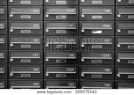 Traditional Residential Metal Postboxes With Apartment Numbers At The Modern Multifamily Building