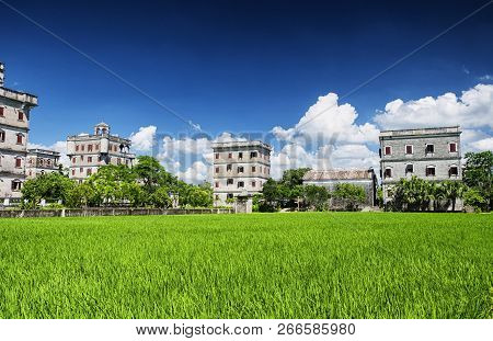 The Historic Buildings And A Rice Paddy At Kaiping Diaolou In Zili Village In Kaiping China In Guang