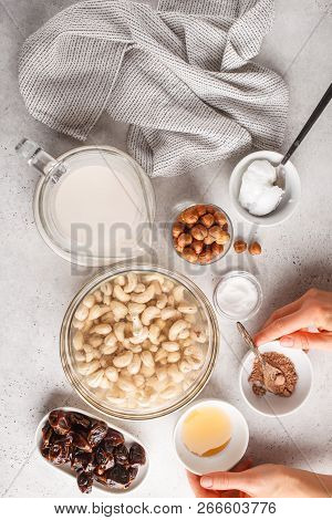 Ingredients For Raw Vegan Cake, Cashew Cake On A White Background, Flat Lay. Plant Based Dit Dessert