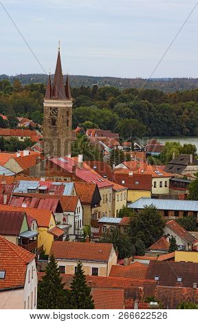 Aerial View Of Red Tile Roofs In Telc. Clock Tower In Historic Centre Of Telc. A Unesco World Herita