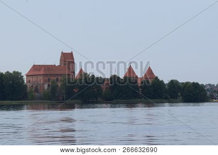 Tracai Castle On The Island In The Lake. Reflection In Water.