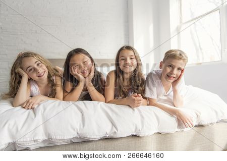 Large Group Of Her Friends Taking Goog Time On Bed