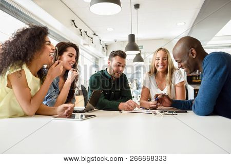 Five Young People Studying With Laptop And Tablet Computers On White Desk. Beautiful Girls And Guys 