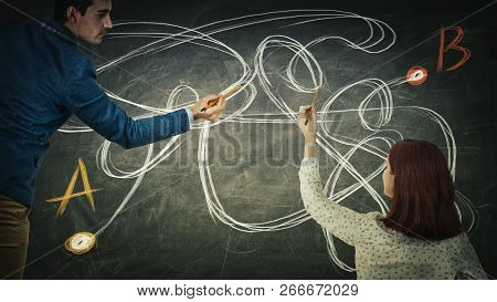 Puzzled Man And Woman Sharing Thoughts Together Finding The Correct Way From Point A To Point B. Sol
