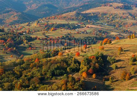 Fall In Slovakia. Meadows And Fields Landscape Near Hrinova. Autumn Colored Cherry Trees At Sunset