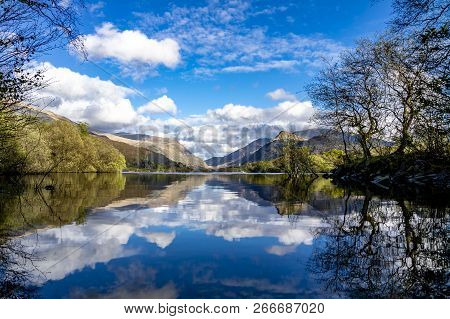 Reflections At Llyn Padarn With Dolbadarn Castle At Llanberis In Snowdonia National Park In Backgrou