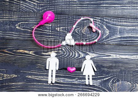 He And She Are Cut Out Of Paper, A Phonendoscope Of Children And Sent To Him. Relationship Establish