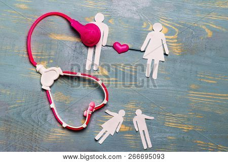 He And She Are Cut Out Of Paper, A Phonendoscope Of Children And Sent To Him. Relationship Establish