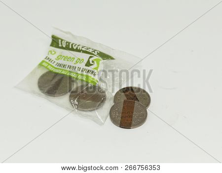 Babylon, New York, Usa - 2 August 2018: Subway Tokens From Philadelphis Are Spilling Out Of A Ten Pa