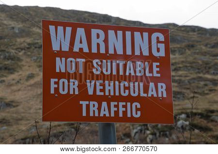 Warning Sign On Tiny Bridge In Scottish Highlands