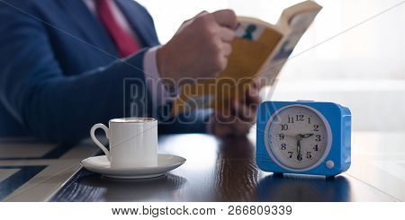 The Concept Of Investing In Yourself And Getting New Knowledge. In The Photo, A Businessman Reads A 