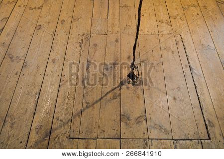 Wooden Square Old Hatchway In The Cellar In The Floor Of Wooden Planks.